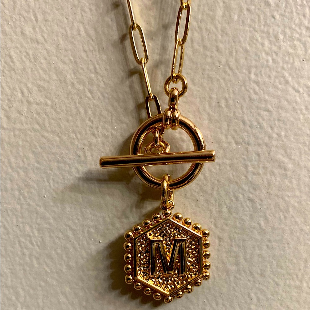 NWOT. Chain necklace with letter M pendant. Heart on back. Gold fashion jewelry.